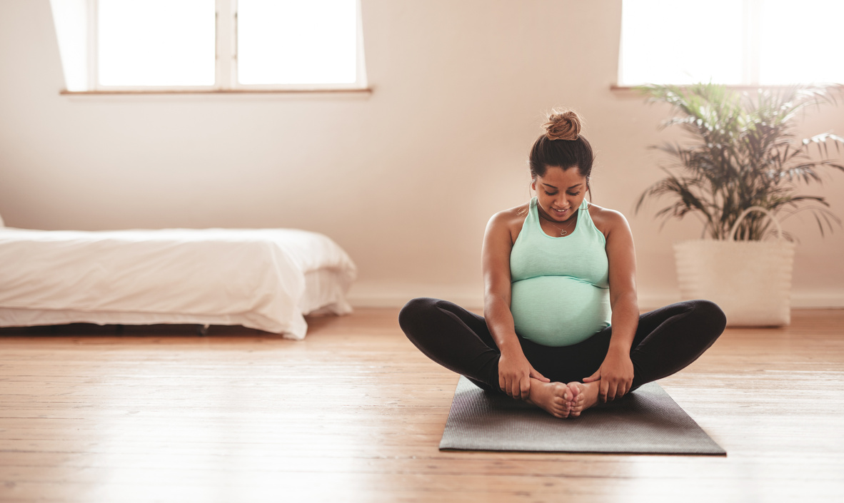 Pregnant Mother Doing Yoga at Home